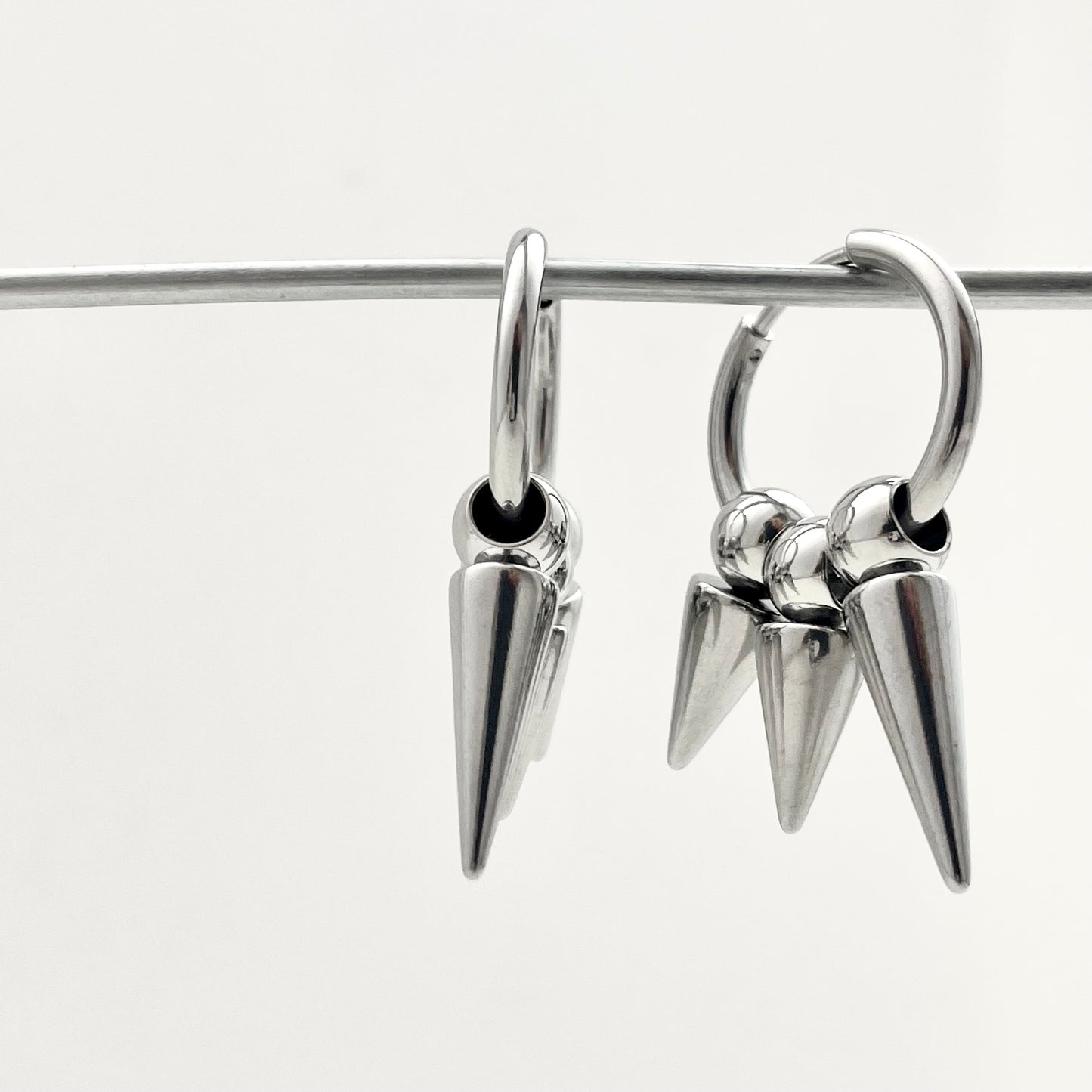 Titanium Steel Three-Rivet Pendant Earrings