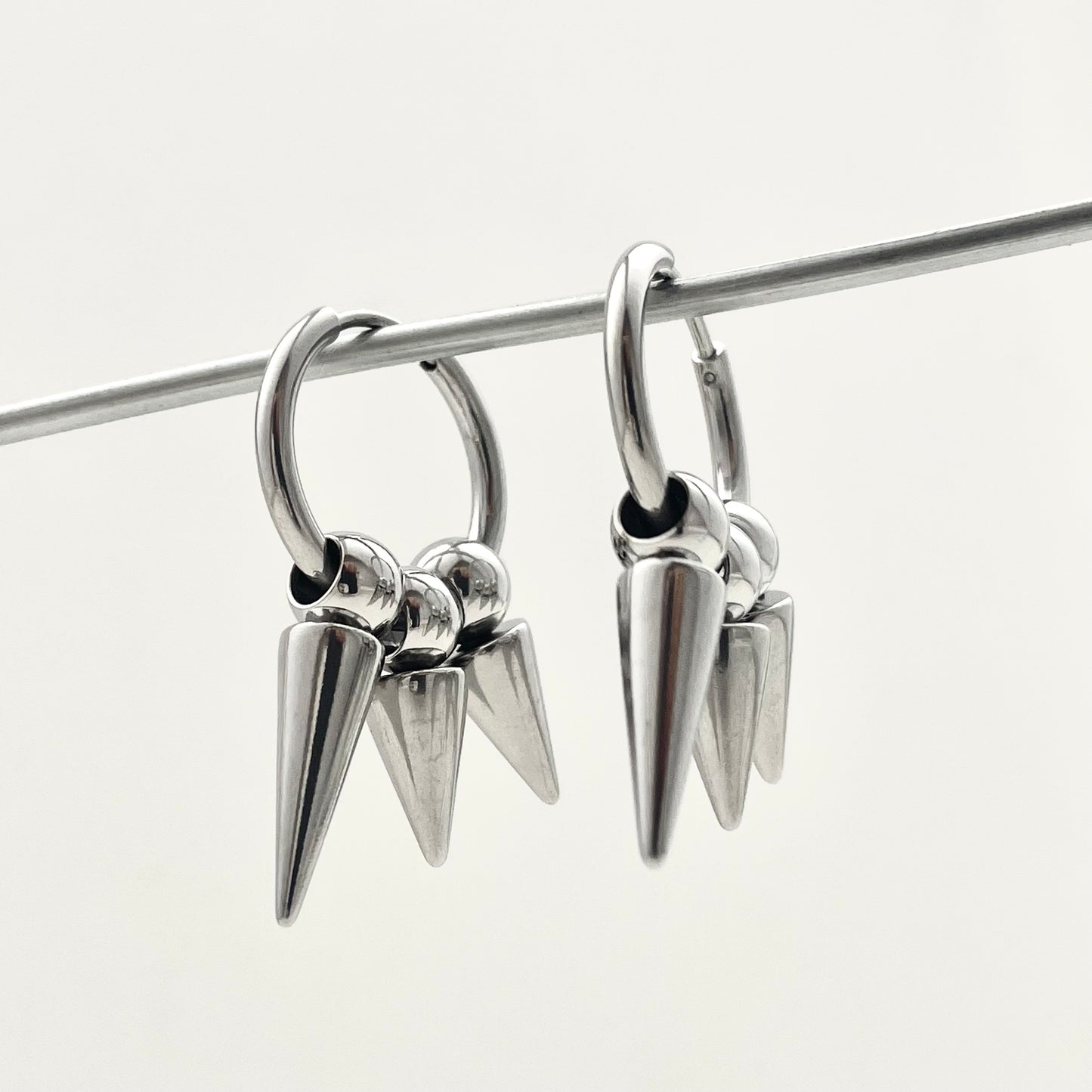 Titanium Steel Three-Rivet Pendant Earrings