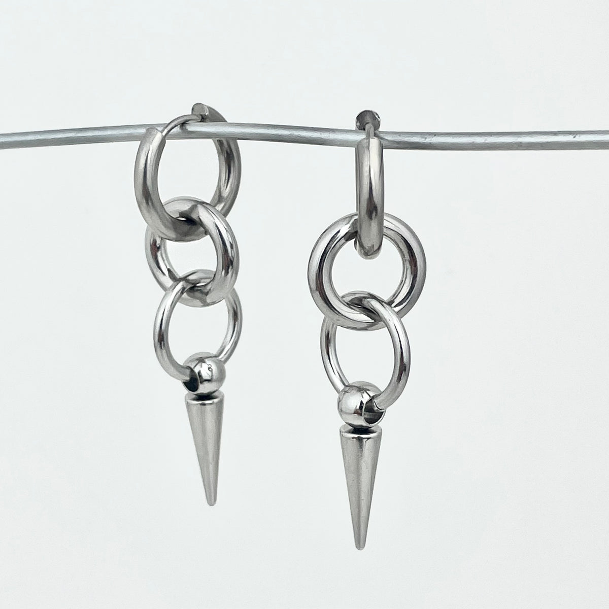 Titanium-Steel Waterproof Pointed Cone Pendant Earrings
