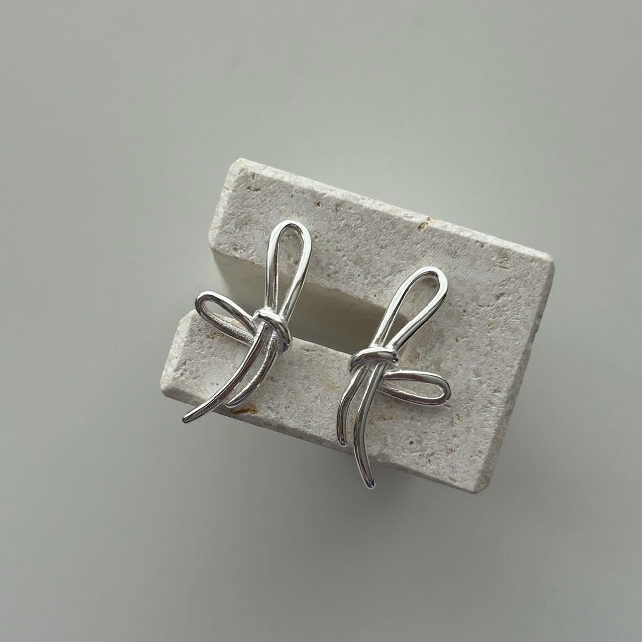 S925 Sterling Silver Through Silver Bow Earrings