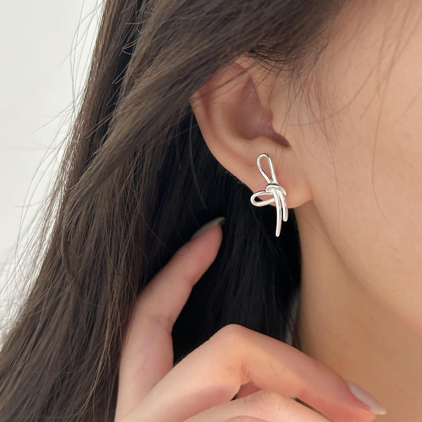 S925 Sterling Silver Through Silver Bow Earrings