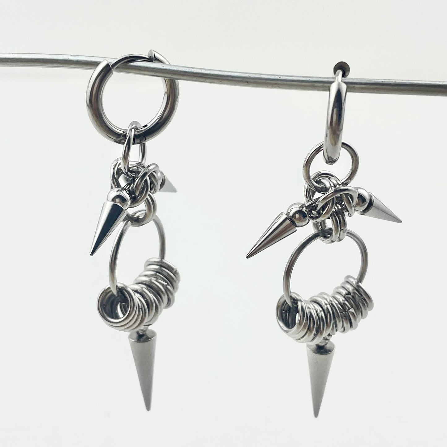 Titanium Waterproof Earrings with Conical Rivet Pendants