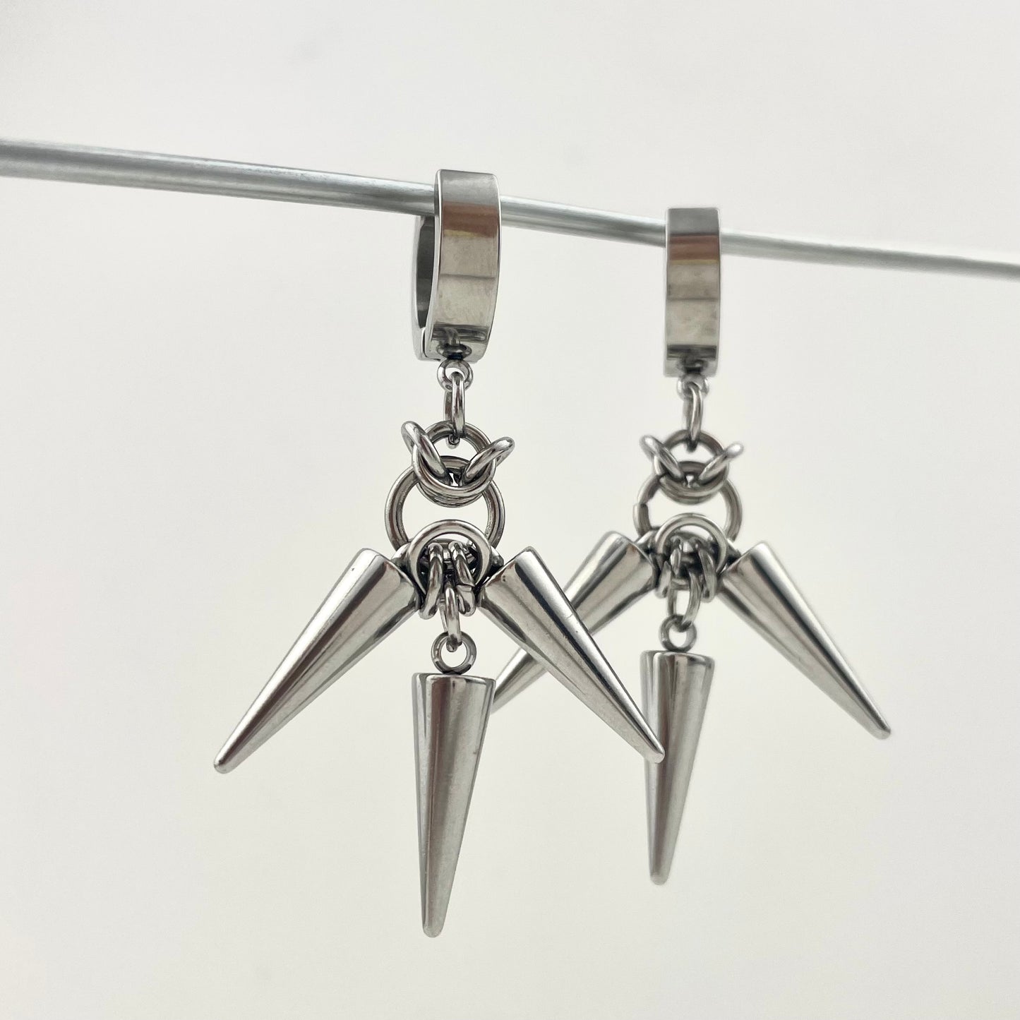 Titanium Waterproof Earrings with Three Rivets and Spiked Pendant