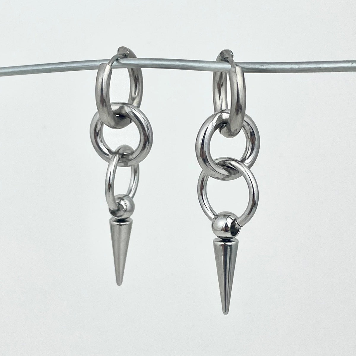Titanium-Steel Waterproof Pointed Cone Pendant Earrings