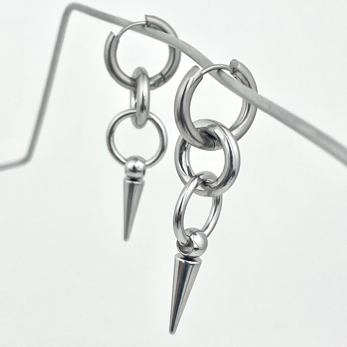 Titanium-Steel Waterproof Pointed Cone Pendant Earrings