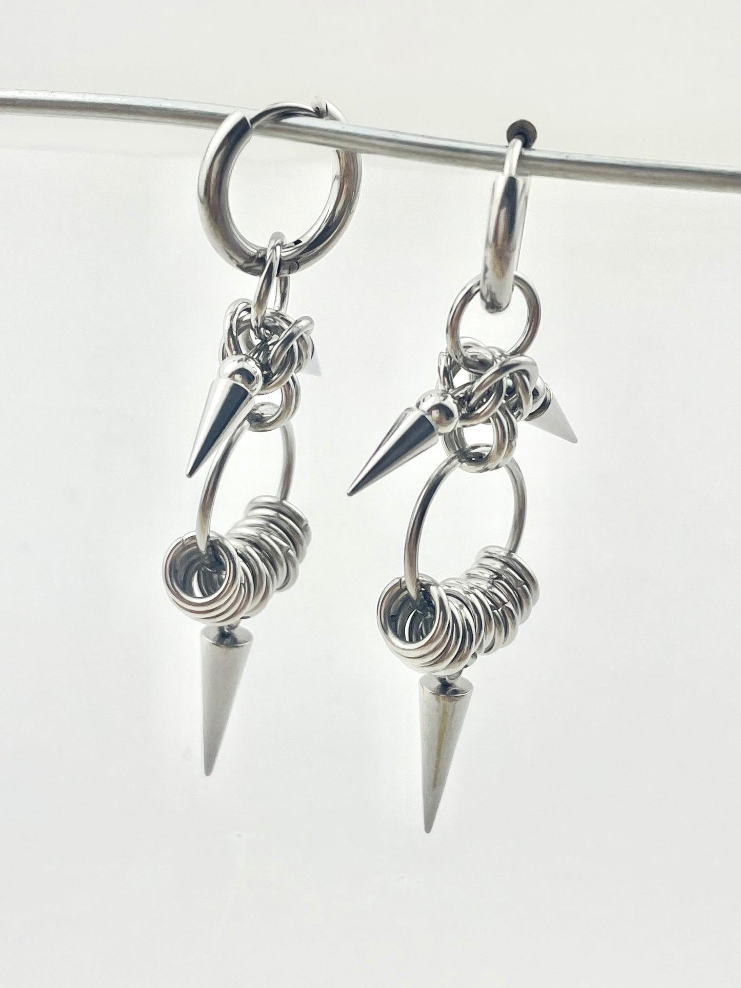 Titanium Waterproof Earrings with Conical Rivet Pendants