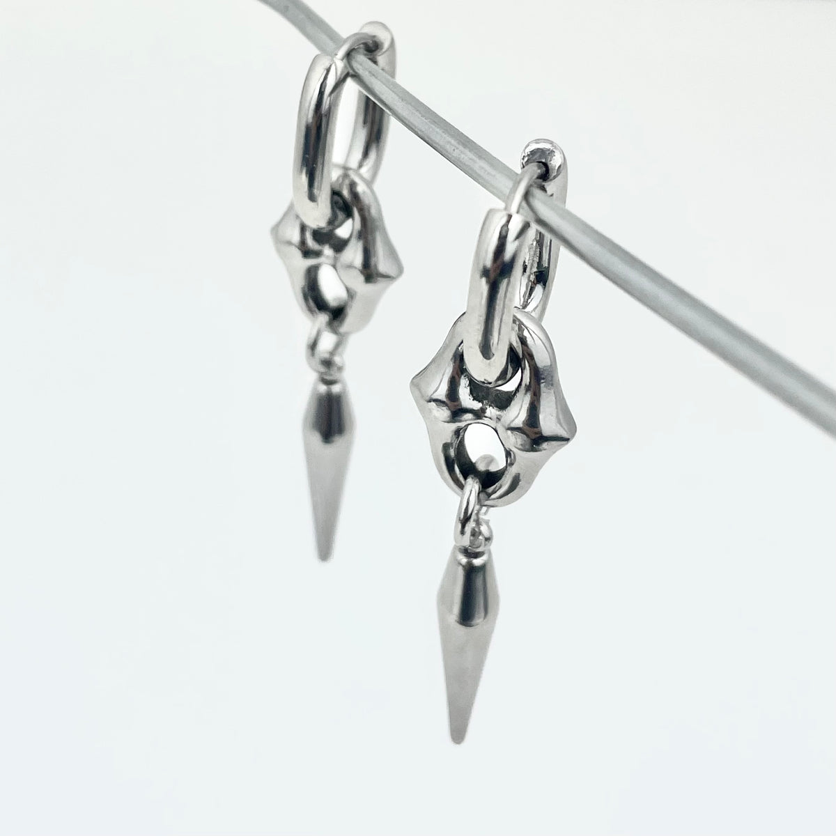 Titanium-Steel Waterproof Pointed Cone Pendant Earrings