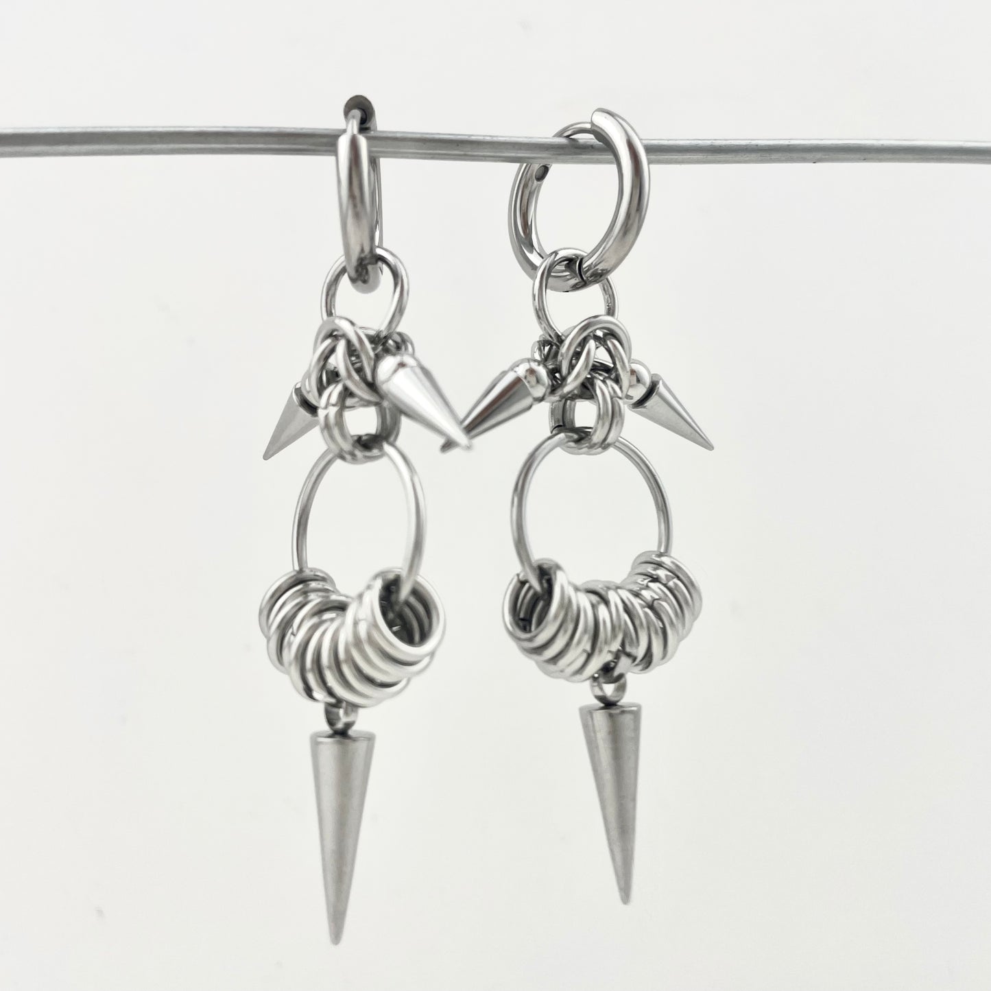 Titanium Waterproof Earrings with Conical Rivet Pendants