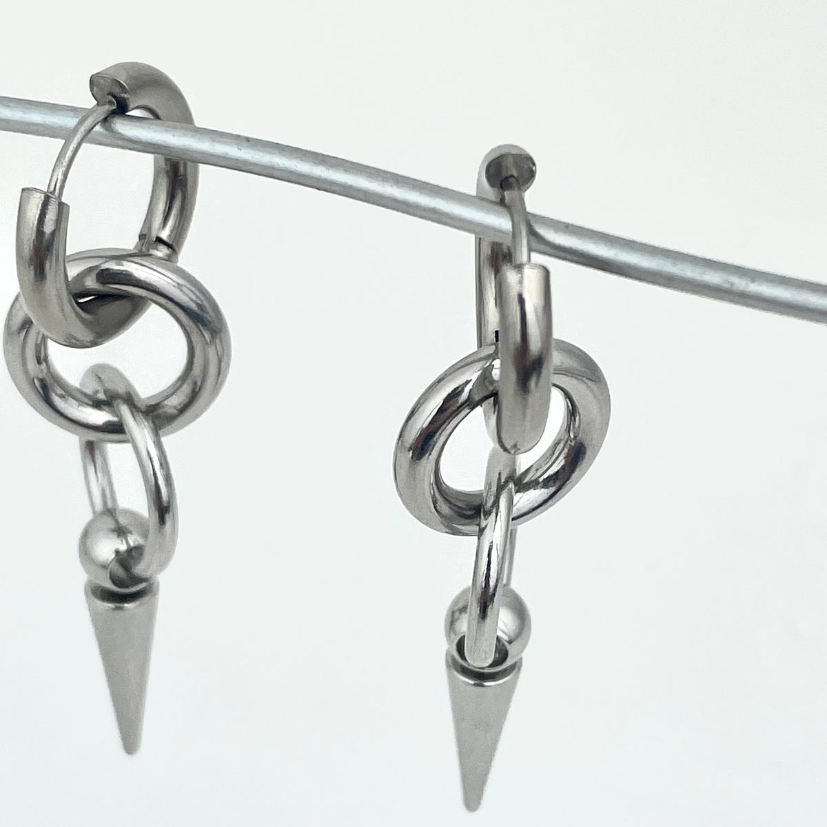 Titanium-Steel Waterproof Pointed Cone Pendant Earrings