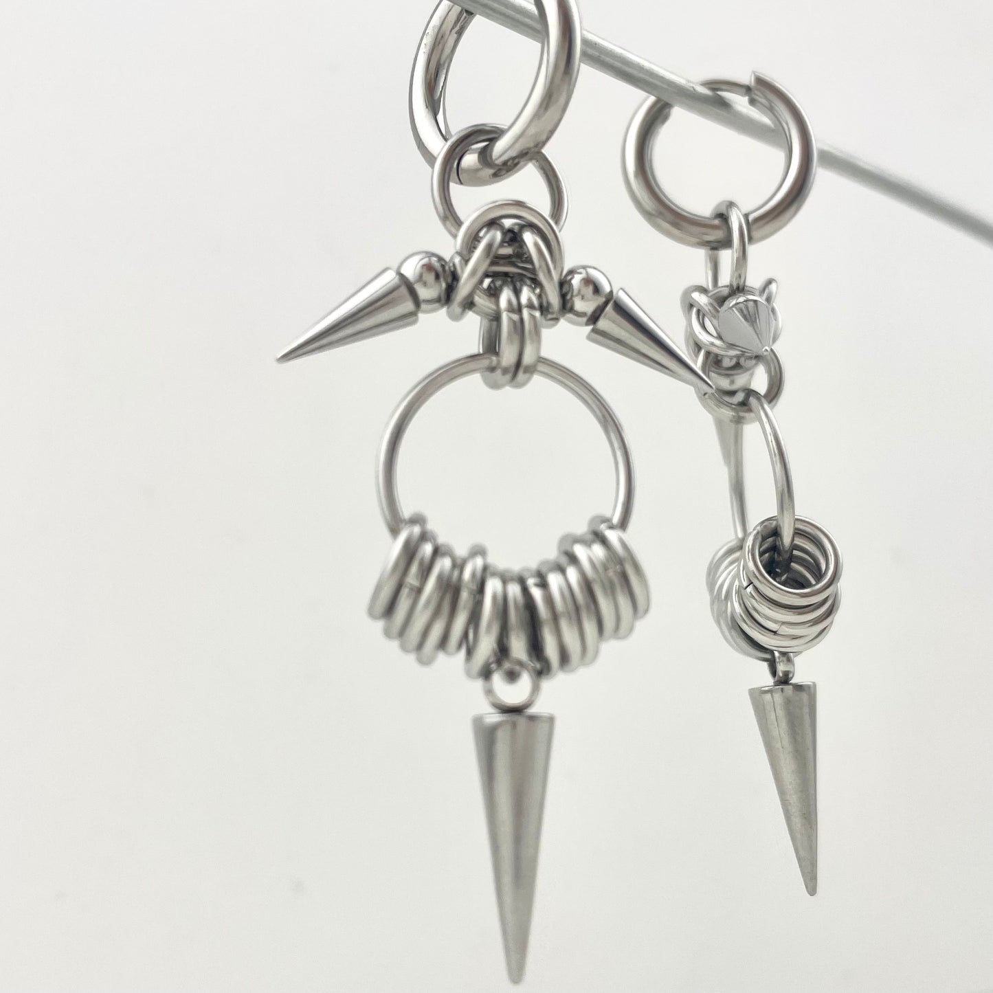 Titanium Waterproof Earrings with Conical Rivet Pendants